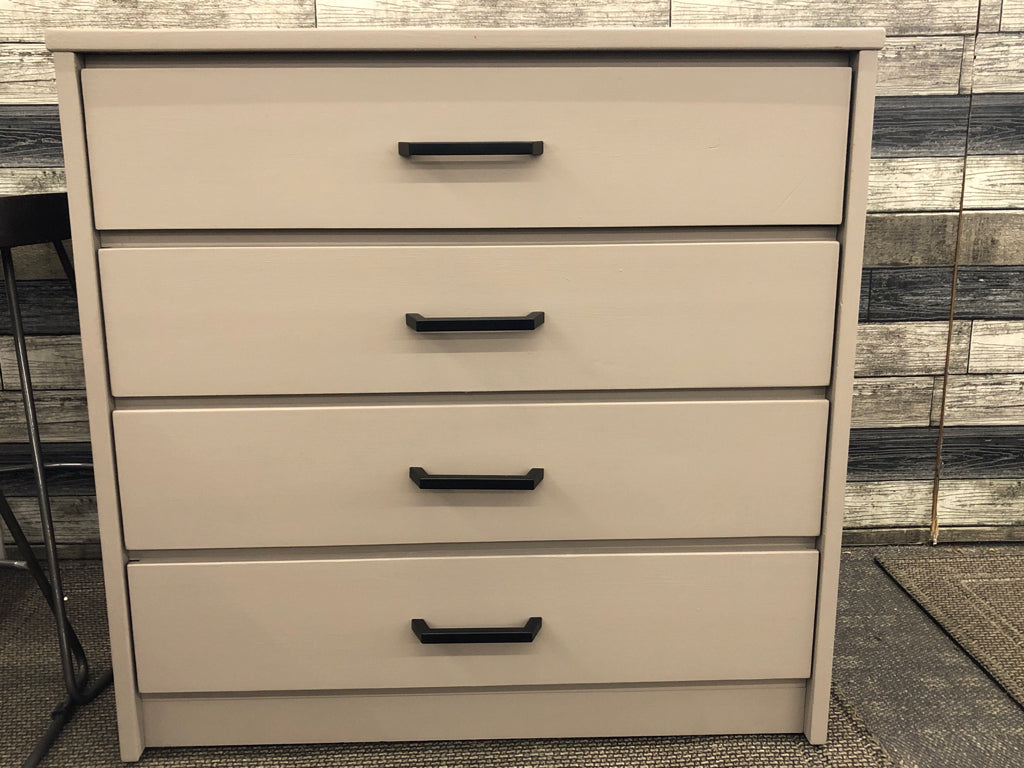 4-DRAWER BEIGE DRESSER.