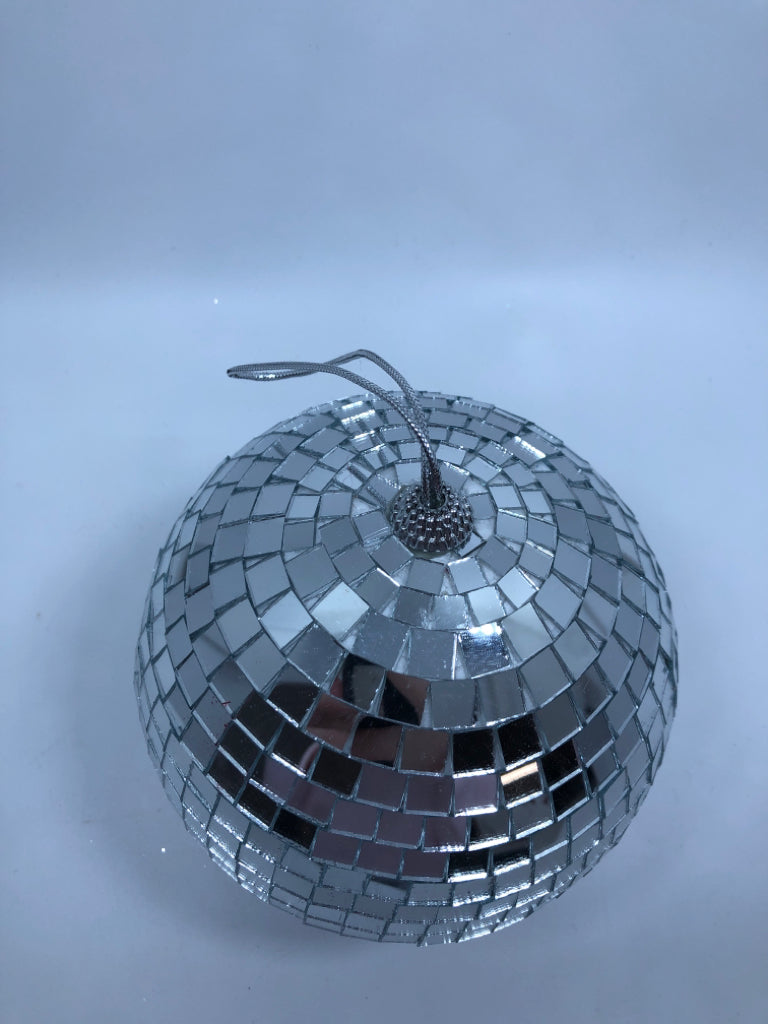 SILVER DISCO BALL ORNAMENT.