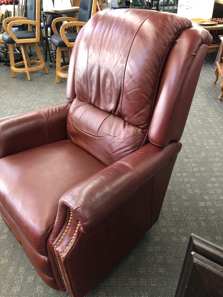 RED LEATHER RECLINER W/GOLD BUTTON DETAILS.