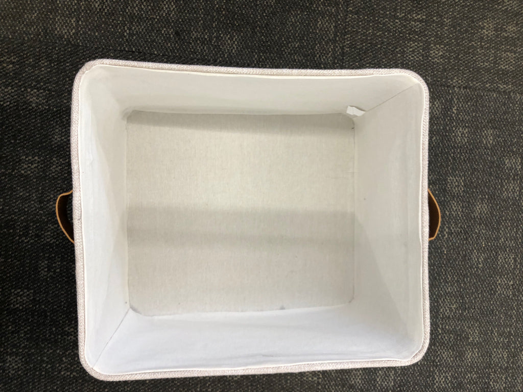 GREY FABRIC STORAGE BIN W/FAUX LEATHER HANDLES.