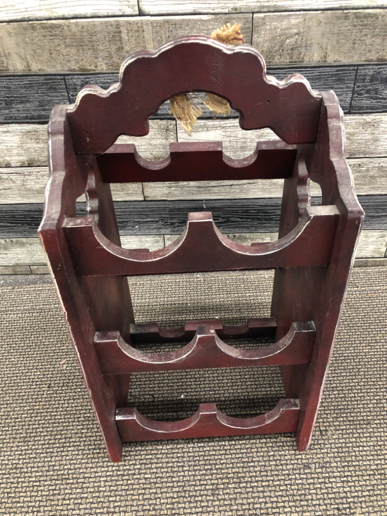 PRIMITIVE WINE HOLDER.
