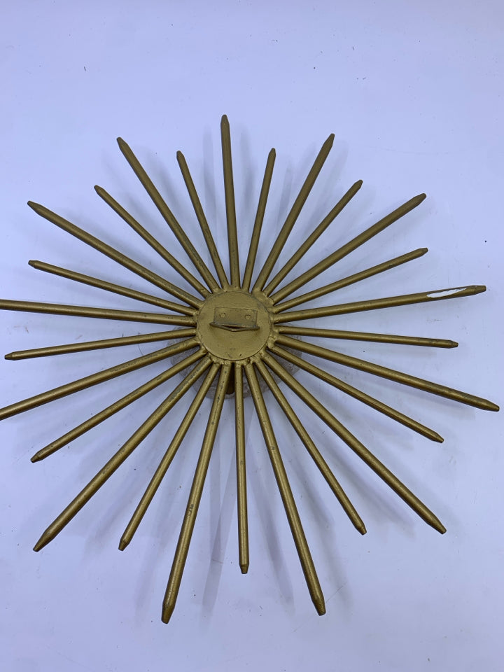 SMALL BRASS STARBURST W/ WHITE QUARTZ ROCK.