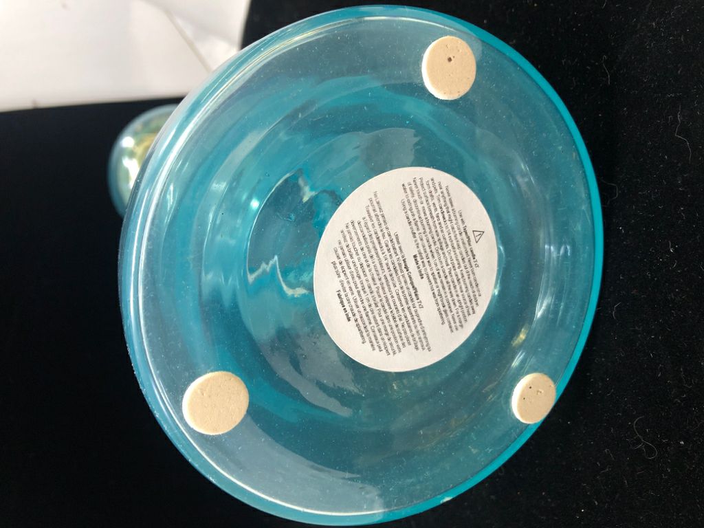 LIGHT BLUE GLASS CANDLE HOLDER.