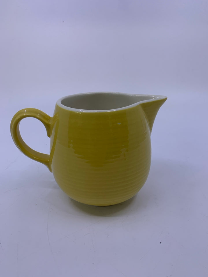 SMALL YELLOW RIBBED PITCHER.
