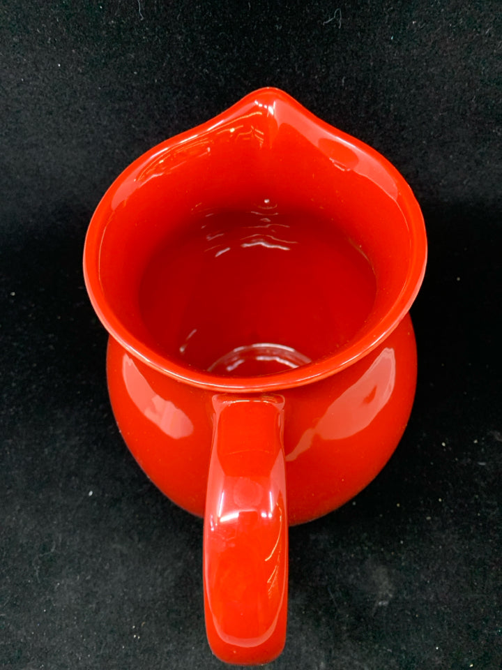 RED CERAMIC PITCHER.