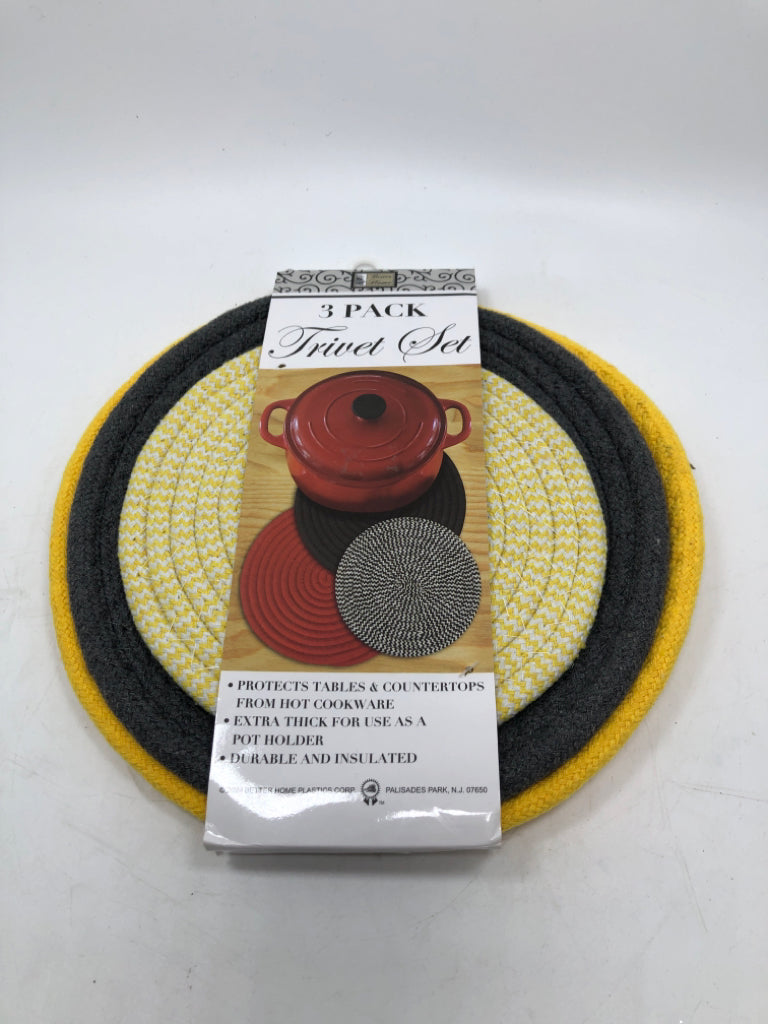 NWT YELLOW AND GREY 3 PACK TRIVET SET.