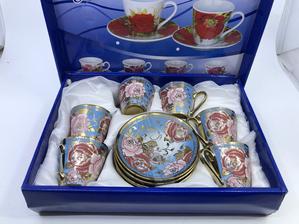 NIB 6 FLORAL CUP AND SAUCER SET.