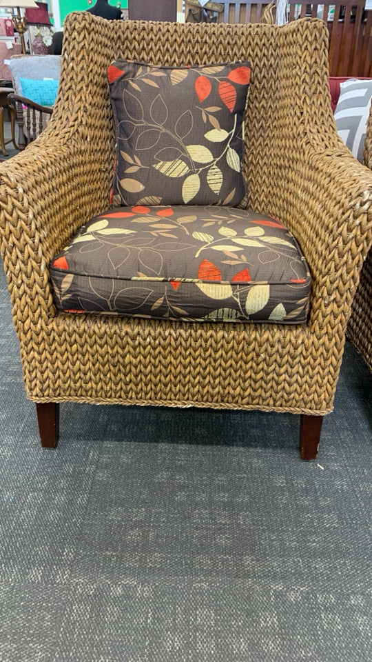 WICKER CHAIR W/BROWN CUSHION.
