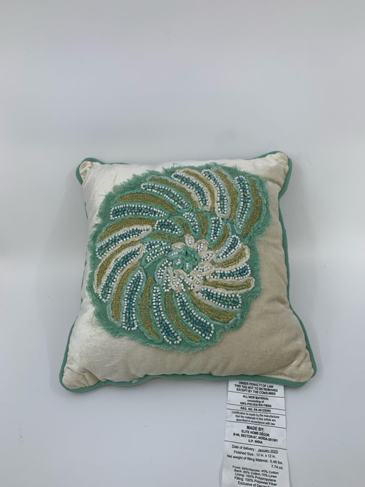 SMALL BEADED SHELL PILLOW.