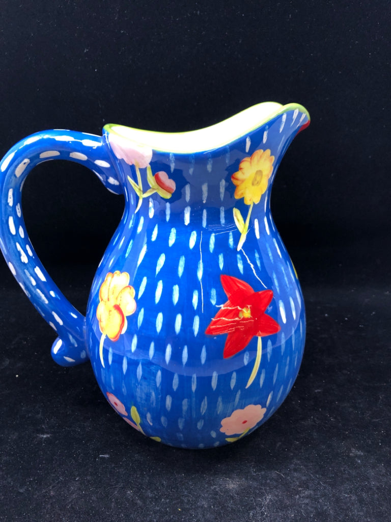 BLUE FLORAL PAINTED PITCHER.