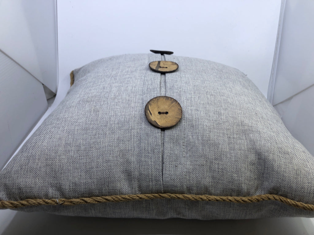 LIGHT GREY SQUARE PILLOW W/ LARGE BUTTONS/ROPE TRIM.