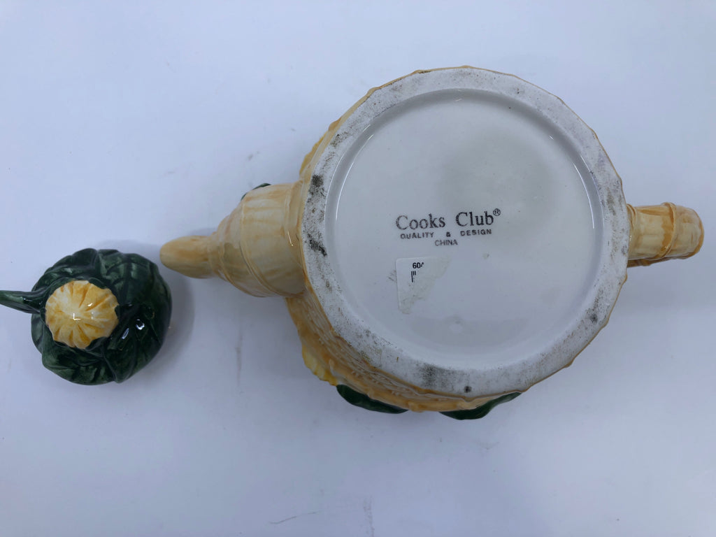 CERAMIC TEAPOT BASKET SHAPED W/ EMBOSSED SUNFLOWERS.