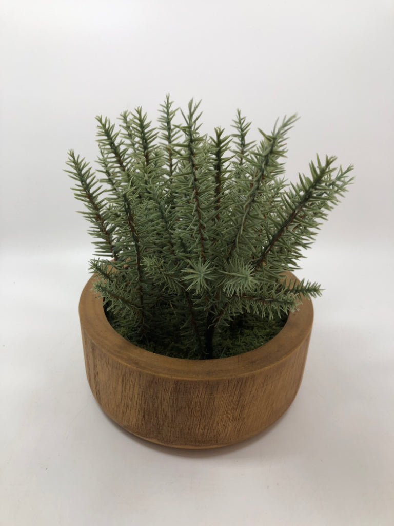 FAUX GREENERY IN WOOD POT.