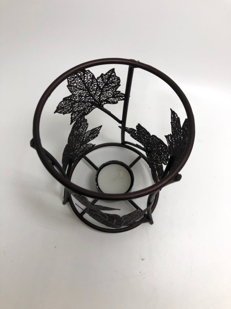 METAL LEAF CANDLE HOLDER.