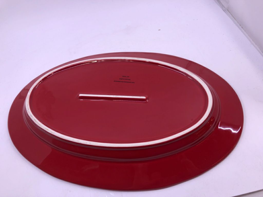 RED OVAL SERVING PLATTER W/ EMBOSSED EDGE.
