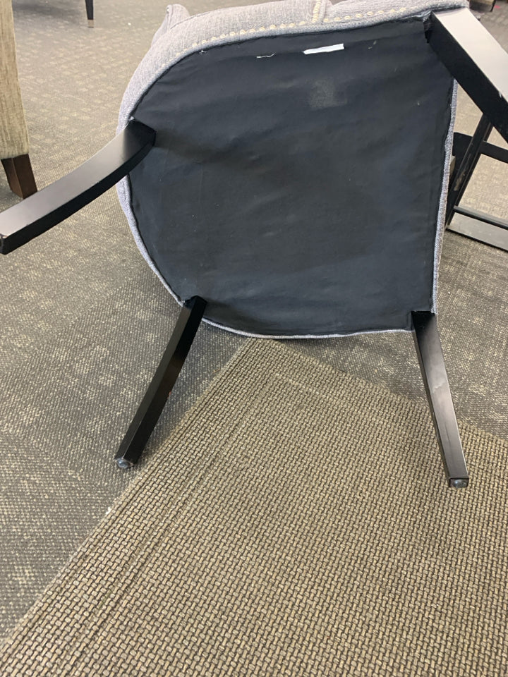 DARK GREY ACCENT CHAIR W/ BLACK LEGS STUDDED EDGE.