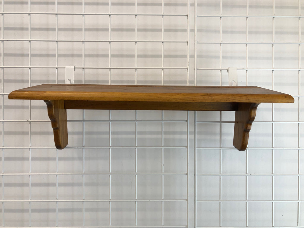 SHORT WOODEN WALL SHELF.