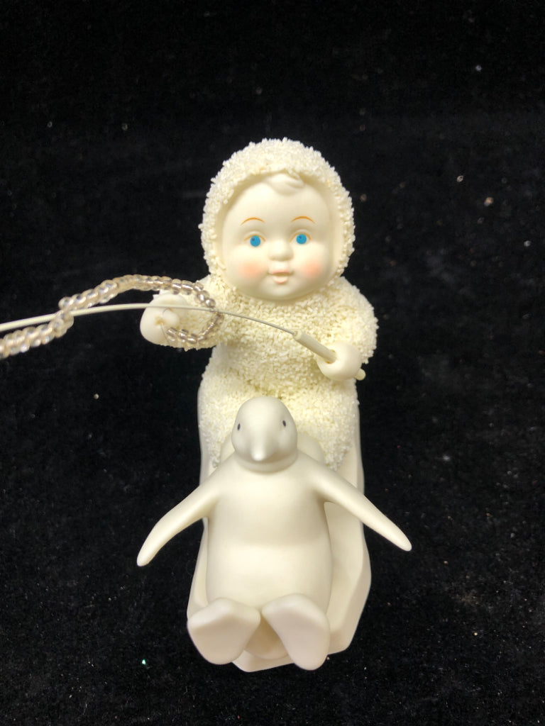 SNOW BABY A SERVANTS HEART HOLDING FISHING POLE.