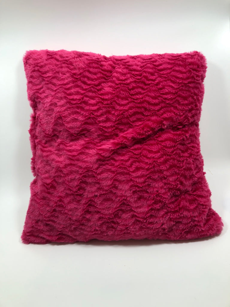 FUZZY PINK THROW PILLOW.