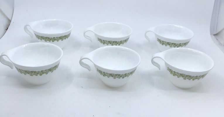 6 CORELLE GREEN FLOWER CUPS W/ CURVED HANDLE.