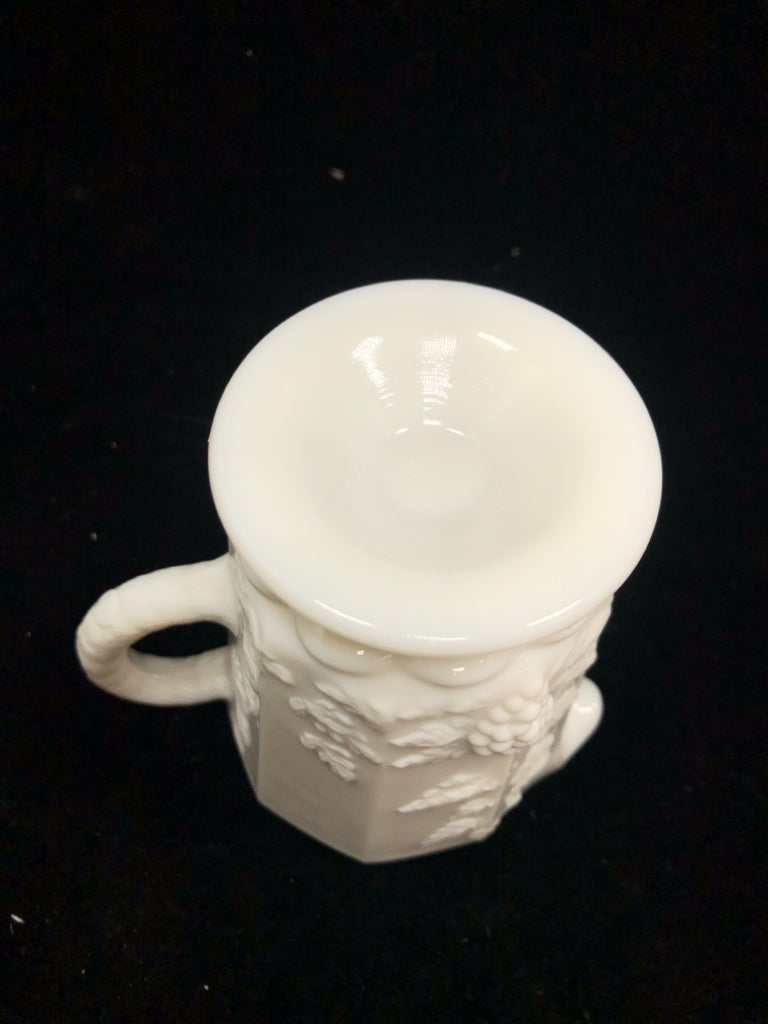 VTG MILK GLASS PITCHER W/EMBOSSED FLORAL DESIGNS.