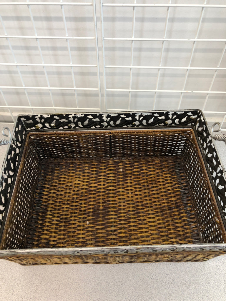 BROWN WOVEN BASKET W/METAL FLORAL RIM AND HANDLES.
