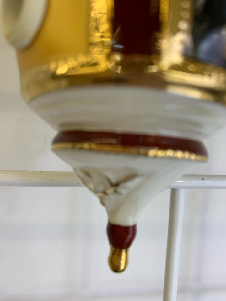 CERAMIC NATIVITY OF PEACE ORNAMENT.