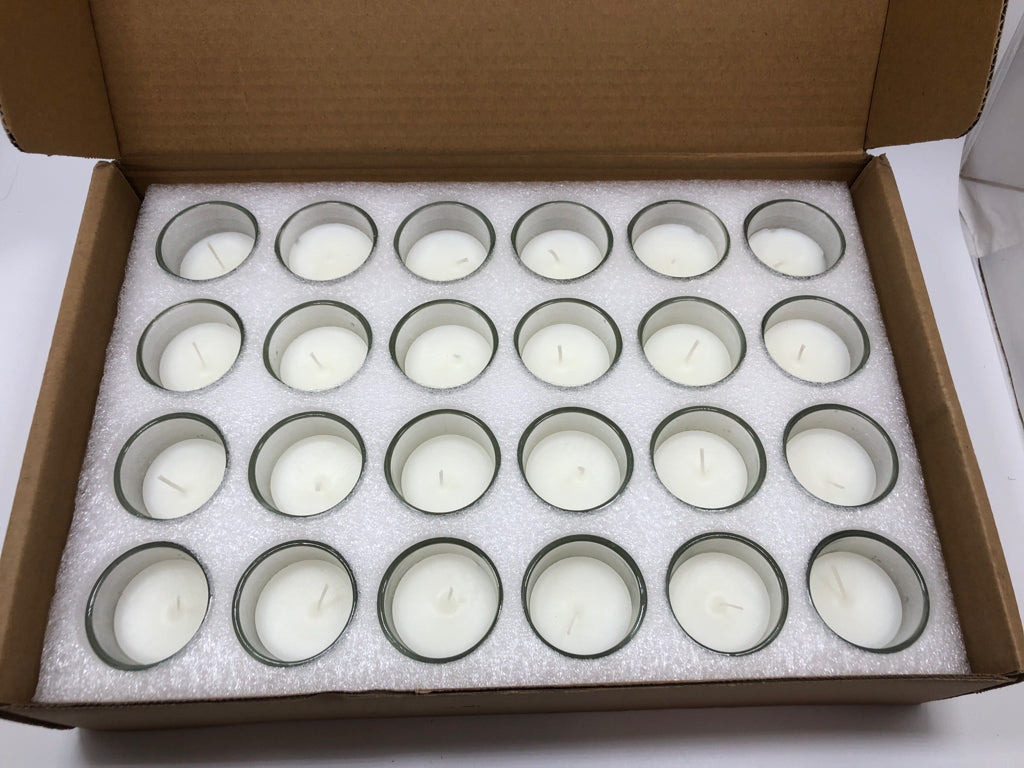 NIB 24PK UNSCENTED CLEAR GLASS VOTIVE CANDLES.