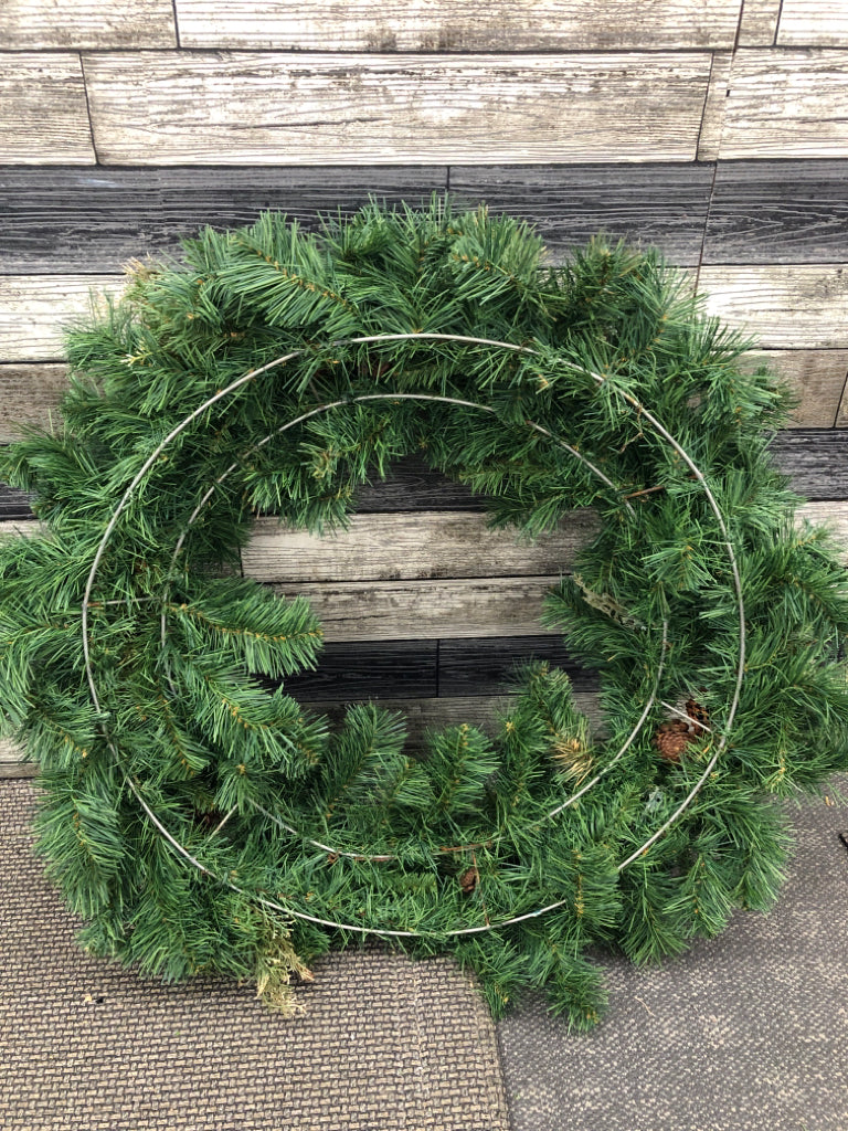 LARGE WREATH W/PINECONES AND TWIGS.