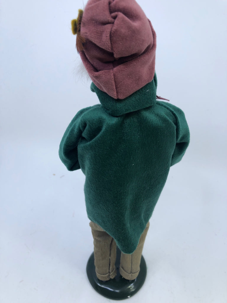 BYERS' CHOICE MAN IN GREEN COAT HOLDING NUTS-1993.