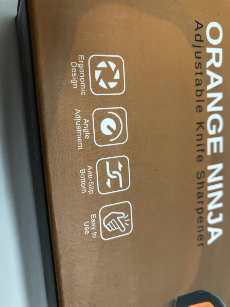 NIB ORANGE NINJA KNIFE SHARPENER.