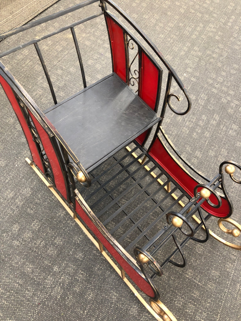 DISTRESSED METAL AND STAINED GLASS SLEIGH.