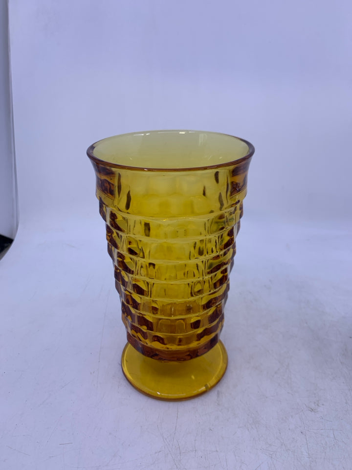 TEXTURED AMBER GLASS FOOTED VASE.