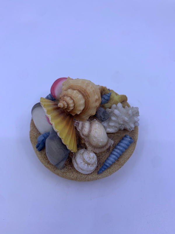 DIFFERENT SHELLS CANDLE COVER.