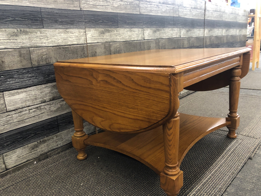 SOLID WOOD 2 TIER COFFEE TABLE W/ 2 DROP LEAF ENDS.