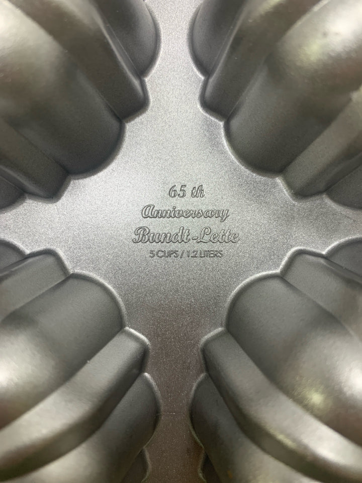 65TH ANNIVERSARY MINI BUNDT 6 CAVITY CAST ALUMINUM PAN.
