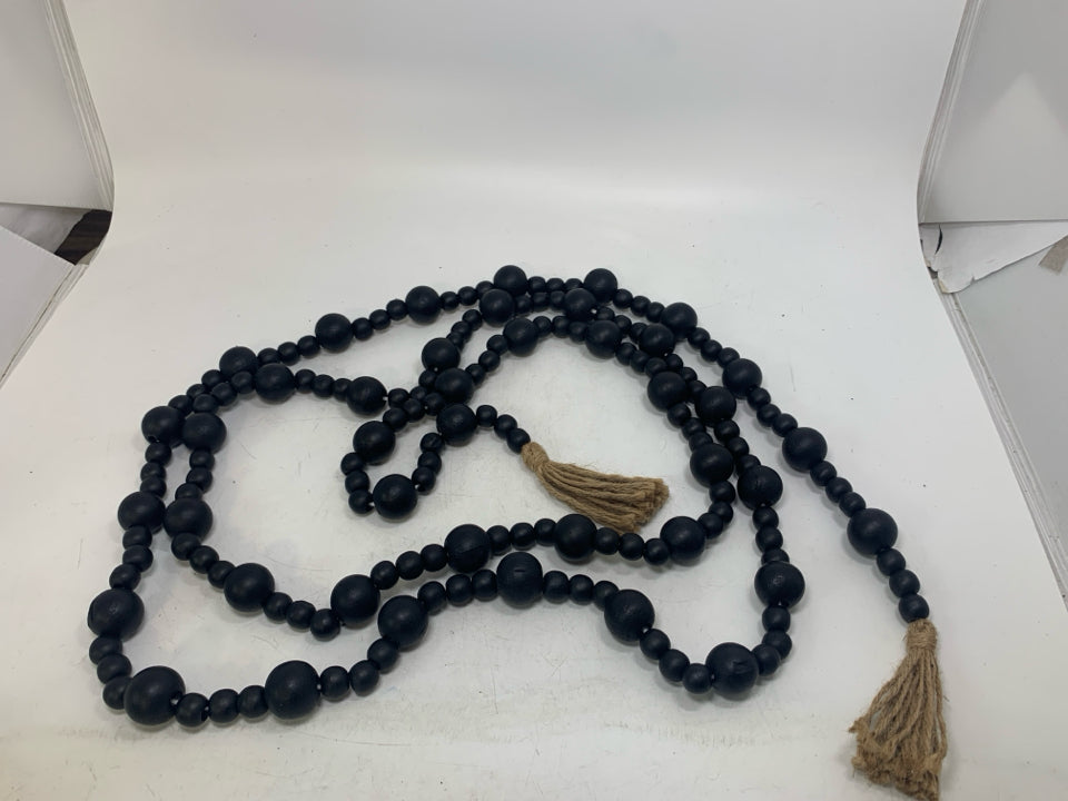 BLACK BEADS W/ TASSELS GARLAND.