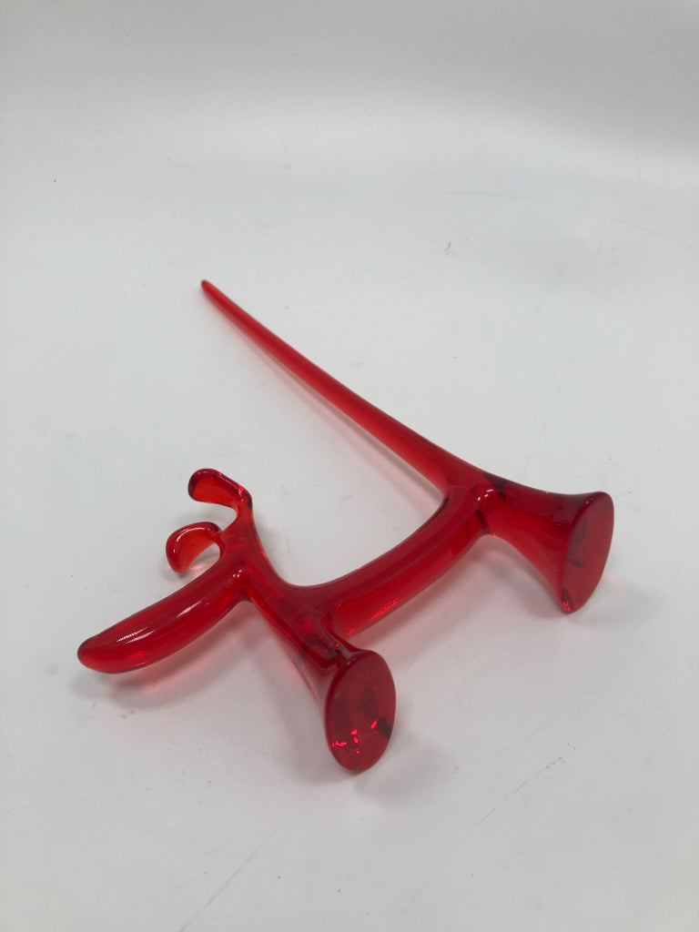 RED RESIN DOG SCULPTURE.