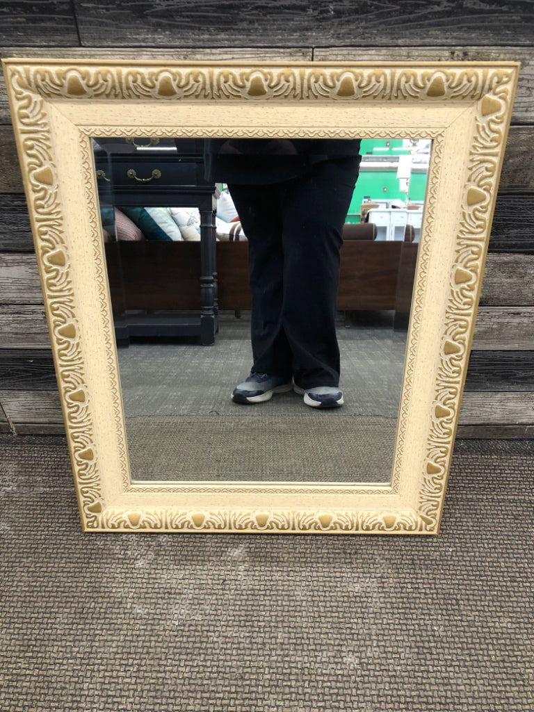 CREAM WALL MIRROR W/GOLD ACCENTS.