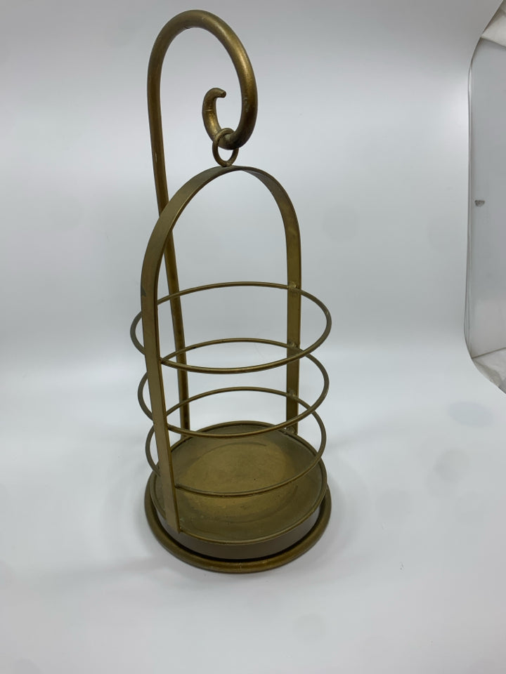 SWINGING GOLD CANDLE LANTERN.