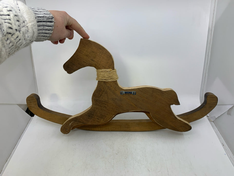 WOOD PRIMITIVE STYLE ROCKING HORSE W/ GREEN HEART AROUND NECK.