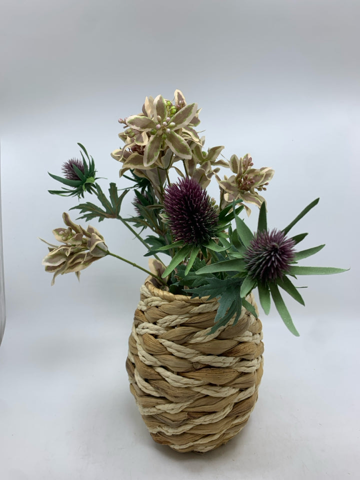 FLORAL MIX IN WICKER VASE.