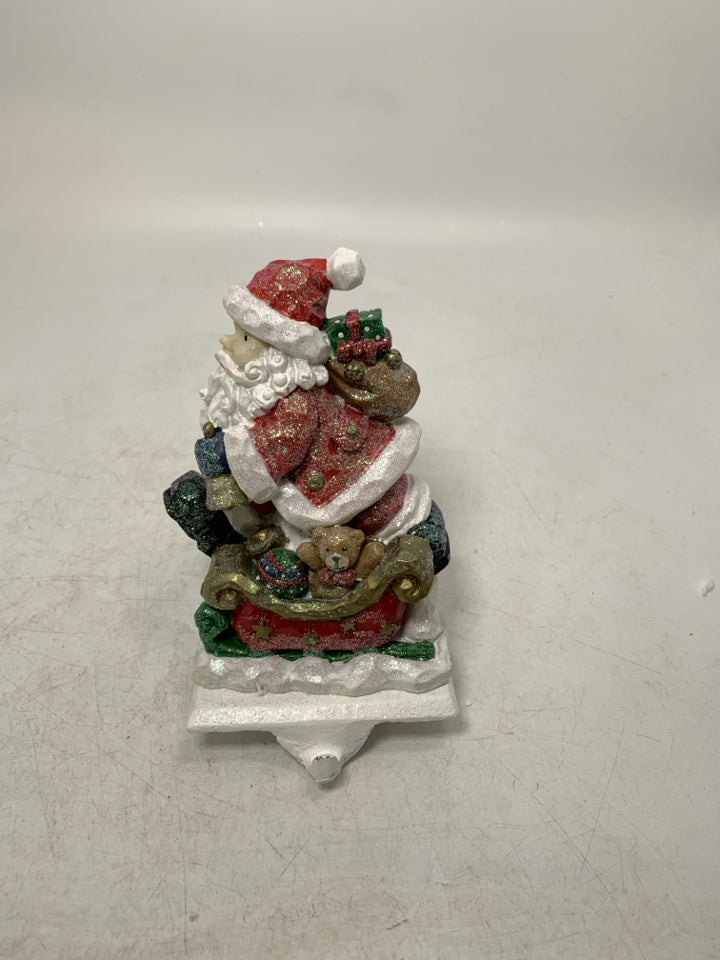 SPARKLE SANTA W/ SLAY/ SACK ON BACK STOCKING HANGER.