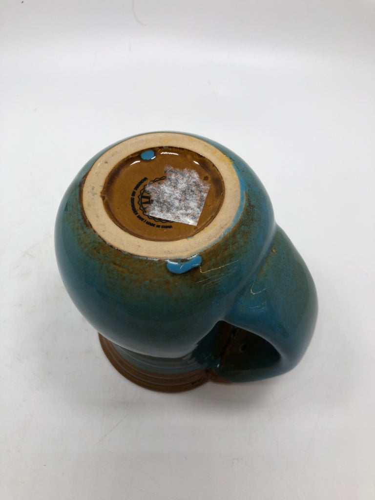 TEAL GLAZED COFFE MUG W/TURTLE.