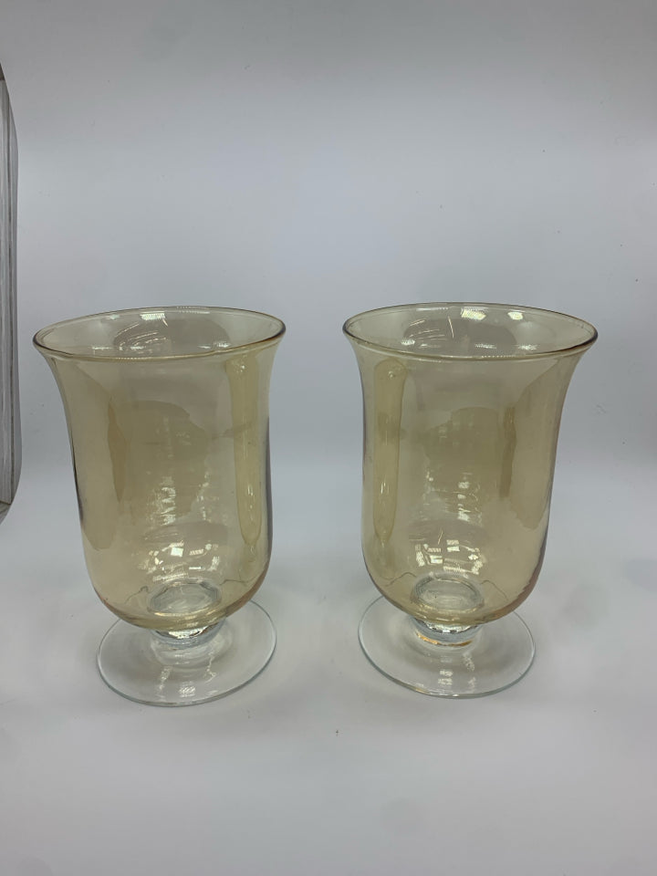 2 AMBER IRIDESCENT FOOTED HURRICANE VASES.