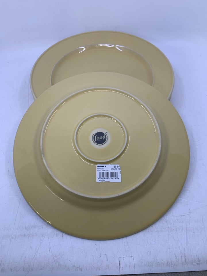 4 PALE YELLOW DINNER PLATES.