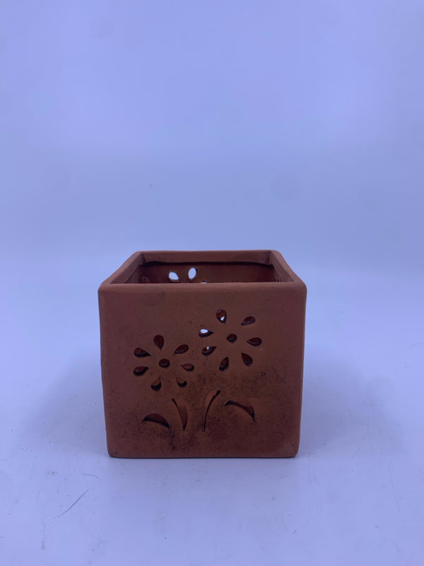 SQUARE FLORAL PIERCED TERRA COTTA CANDLE HOLDER.