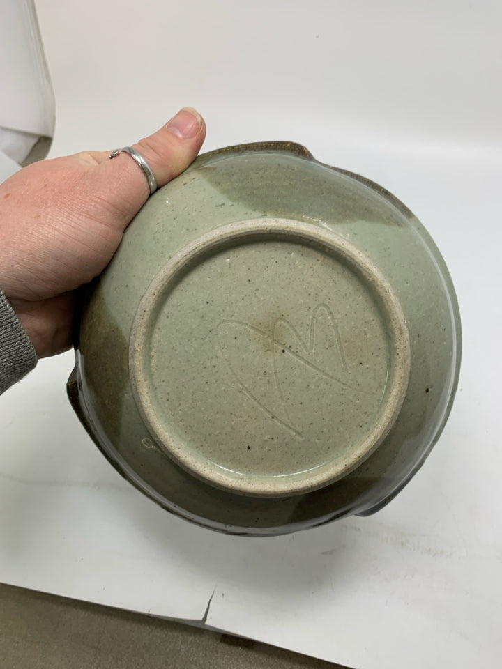 MULTI COLORED POTTERY BOWL W/ RED/BLUE FLOWERS UNEVEN EDGE.