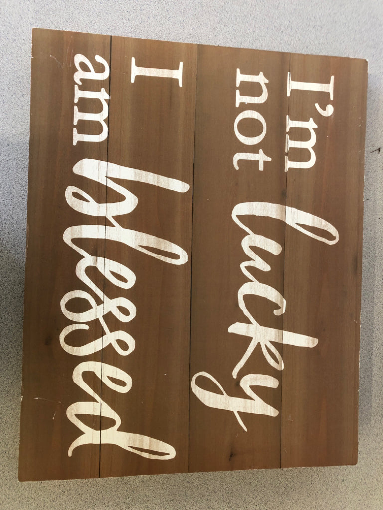 BROWN 'I'M NOT LUCKY' WALL HANGING.