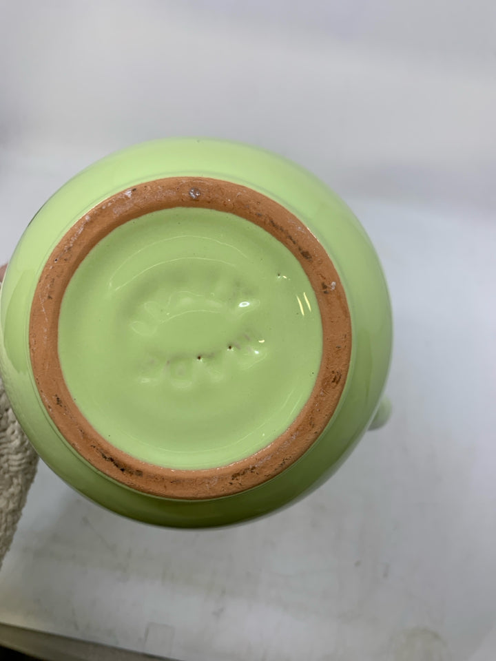 LIGHT GREEN DISTRESSED CERAMIC VASE.